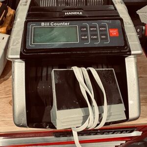 Silver and Black Bill Counter